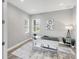 Home office with sleek desk, natural lighting, and neutral color scheme at 10217 Canaveral Cir, Sarasota, FL 34241