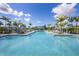 Resort-style pool with blue canopies and lounge chairs at 10217 Canaveral Cir, Sarasota, FL 34241