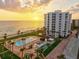 Beautiful aerial view of condo community with swimming pool, landscaping and beachfront access at 1050 Longboat Club Road # 903, Longboat Key, FL 34228
