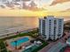 Enjoy a stunning view of the beachfront community with a pristine shoreline and sparkling waters at 1050 Longboat Club Road # 903, Longboat Key, FL 34228