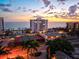 Aerial view of a condominium with community pool, tennis courts, and beautiful beachfront at 1050 Longboat Club Road # 903, Longboat Key, FL 34228