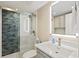 Bathroom with a modern vanity, and a glass enclosed shower featuring blue and grey tile at 1050 Longboat Club Road # 903, Longboat Key, FL 34228