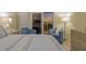 Cozy bedroom with balcony access and comfortable seating area to enjoy sunset views at 1050 Longboat Club Road # 903, Longboat Key, FL 34228