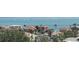 Beautiful waterfront homes with lush tropical landscaping and views of sailboats on the water at 1050 Longboat Club Road # 903, Longboat Key, FL 34228