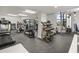 On-site fitness center features modern cardio machines, weightlifting equipment and ample natural light at 1050 Longboat Club Road # 903, Longboat Key, FL 34228