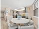 Open-concept kitchen and dining area with modern appliances and stylish décor at 1050 Longboat Club Road # 903, Longboat Key, FL 34228
