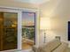 Bright living room featuring a sliding door that leads to a balcony with great views at 1050 Longboat Club Road # 903, Longboat Key, FL 34228