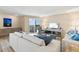Spacious living room with a sliding glass door with a view, creating a seamless indoor-outdoor living experience at 1050 Longboat Club Road # 903, Longboat Key, FL 34228