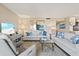 Spacious living room with comfortable seating, contemporary decor, and ample natural light at 1050 Longboat Club Road # 903, Longboat Key, FL 34228