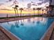 Community pool with lounge chairs and beach access, perfect for relaxation at 1050 Longboat Club Road # 903, Longboat Key, FL 34228