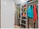 Storage closet with shelving providing space for cleaning supplies, tools, and household items at 1050 Longboat Club Road # 903, Longboat Key, FL 34228