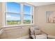 Bright room with a window offering panoramic views of the surrounding landscape and an artistic wall decor at 1050 Longboat Club Road # 903, Longboat Key, FL 34228
