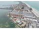 Expansive aerial view of waterfront property with pool, beach and waterway access at 117 7Th N St # 5, Bradenton Beach, FL 34217