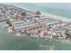 A scenic aerial shot of coastal condos with docks, pools, and easy access to a sandy beach at 117 7Th N St # 5, Bradenton Beach, FL 34217