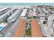 Aerial shot of condos with pools near Gulf of Mexico at 117 7Th N St # 5, Bradenton Beach, FL 34217