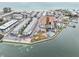 Aerial view of multi-Gathering building near the beach, surrounded by other buildings, coastal area at 117 7Th N St # 5, Bradenton Beach, FL 34217