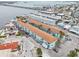 Aerial view of a multi-Gathering building in a coastal city with a bridge in the distance at 117 7Th N St # 5, Bradenton Beach, FL 34217