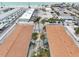 Aerial view of property and parking area with palm trees and steps leading up to the units at 117 7Th N St # 5, Bradenton Beach, FL 34217