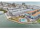 A scenic aerial view showcases the complex, a pool, proximity to beaches, and ample parking at 117 7Th N St # 5, Bradenton Beach, FL 34217
