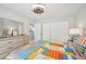 Bedroom with closet, dresser and bright comforter at 117 7Th N St # 5, Bradenton Beach, FL 34217