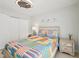 Inviting bedroom featuring a bright bedspread and nautical decorations at 117 7Th N St # 5, Bradenton Beach, FL 34217
