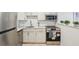 Updated kitchen featuring stainless steel appliances, marble countertops, and sleek white cabinetry for a modern feel at 117 7Th N St # 5, Bradenton Beach, FL 34217