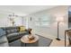 Comfortable living room with leather couch, seahorse decor, and natural light at 117 7Th N St # 5, Bradenton Beach, FL 34217