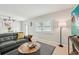 A cozy living room featuring modern decor, comfortable seating, and a bright window at 117 7Th N St # 5, Bradenton Beach, FL 34217