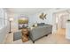 Relaxing living room with neutral tones, a stylish sectional, and coastal decor creates a serene atmosphere at 117 7Th N St # 5, Bradenton Beach, FL 34217