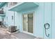 View of patio featuring slider door and air conditioning unit at 117 7Th N St # 5, Bradenton Beach, FL 34217