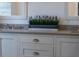 Close-up of bathroom featuring double sinks, stylish countertop and modern faucet at 12615 River Rd, Myakka City, FL 34251