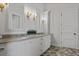 Spacious bathroom with double sinks, mirrors, and decorative lighting at 12615 River Rd, Myakka City, FL 34251