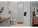The bathroom features patterned tile floors, a walk in shower and plenty of natural light at 12615 River Rd, Myakka City, FL 34251