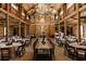 Spacious event space featuring wood beams, chandeliers, and decorated tables ready for a party at 12615 River Rd, Myakka City, FL 34251