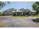 Charming home boasts a manicured front yard and a welcoming porch, plus an attached two-car garage at 12615 River Rd, Myakka City, FL 34251
