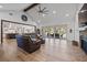 Bright and airy living room with high ceilings, a fireplace, and a seamless connection to the outdoor patio at 12615 River Rd, Myakka City, FL 34251