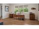 Office showcases natural light, two desks and rich hardwood floors at 12615 River Rd, Myakka City, FL 34251
