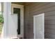 This outdoor shower features neutral siding and a partial privacy wall at 12615 River Rd, Myakka City, FL 34251