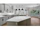 Bright, open kitchen featuring an island, pendant lights, and modern appliances at 12810 Magpie Pl, Bradenton, FL 34212