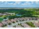 Community aerial view showcasing a beautiful neighborhood with ponds, lush landscaping, and well-maintained homes at 13902 Messina Loop, Bradenton, FL 34211