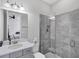 Bathroom featuring a single vanity and walk-in shower with gray tile at 13902 Messina Loop, Bradenton, FL 34211