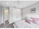 Comfortable bedroom with ceiling fan, closet, and neutral tones at 13902 Messina Loop, Bradenton, FL 34211