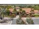 Clubhouse exterior with lush landscaping, and sidewalk to entrance at 13902 Messina Loop, Bradenton, FL 34211
