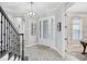 Welcoming foyer with hardwood floors, decorative lighting, and staircase at 13902 Messina Loop, Bradenton, FL 34211