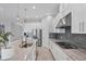Well-appointed kitchen with a central island, modern appliances, and ample counter space for cooking and entertaining at 13902 Messina Loop, Bradenton, FL 34211