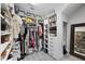 Organized walk-in closet with shelving, hanging rods, drawers, and plenty of storage space at 13902 Messina Loop, Bradenton, FL 34211