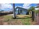 A view of the backyard featuring a well-maintained lawn and perimeter fence at 1609 17Th W St, Bradenton, FL 34205