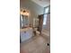 Well-lit bathroom features a modern vanity, toilet and shower/tub combo at 1609 17Th W St, Bradenton, FL 34205