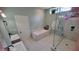 Bright bathroom features a large soaking tub, double sinks and a glass enclosed shower at 1609 17Th W St, Bradenton, FL 34205