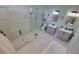 Modern bathroom features dual sinks, a glass-enclosed shower, and contemporary fixtures at 1609 17Th W St, Bradenton, FL 34205